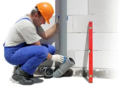 Technician performing trenchless sewer line replacement
