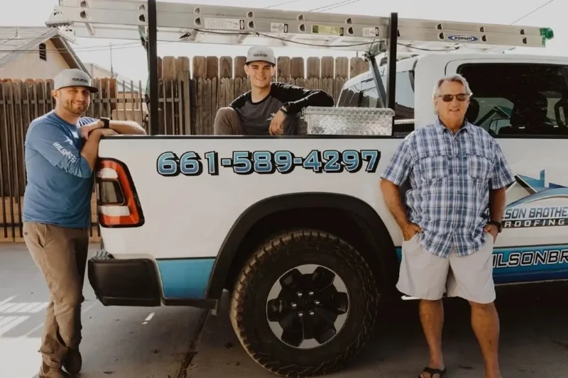 Wilson Brothers Roofing team standing together on-site