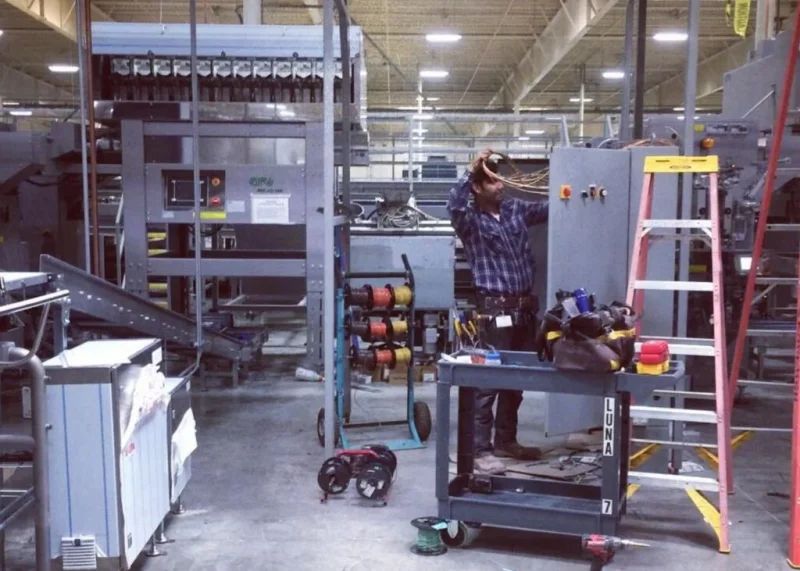 Industrial electrical work in a large facility with wiring and equipment